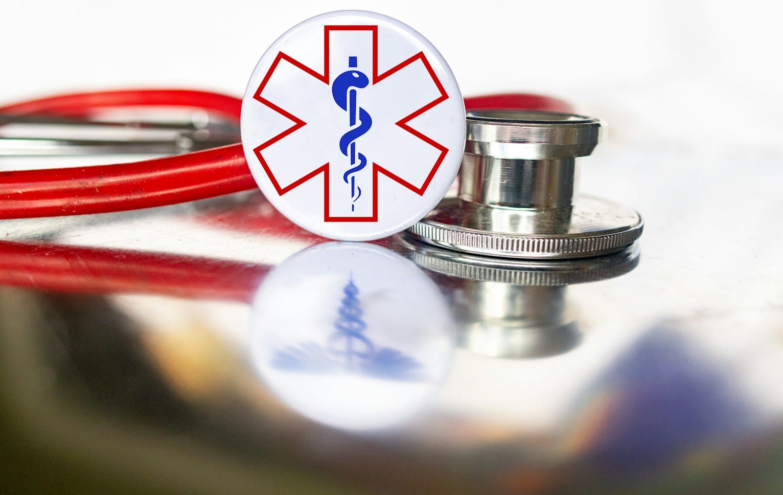 Photo by Marek Studzinski a stethoscope with a medical symbol on it